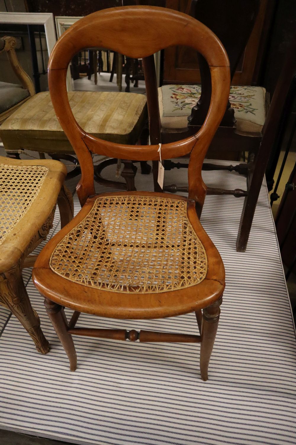 A carved bleached mahogany caned stool and two Victorian chairs